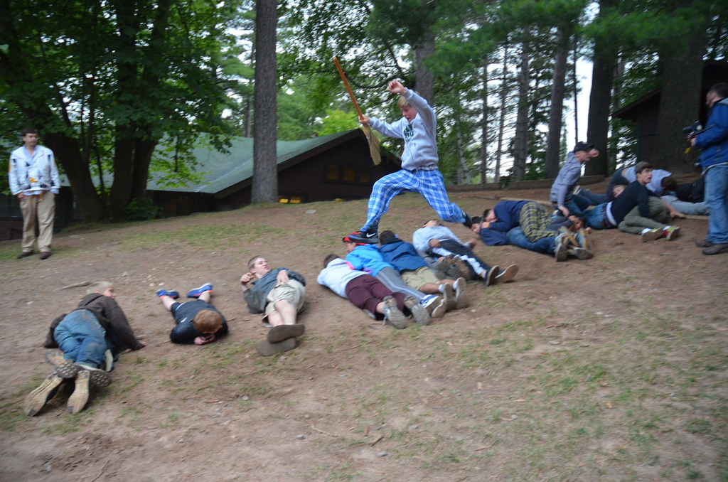 Seniors dash down the hill during the broom race at Games on the Hill